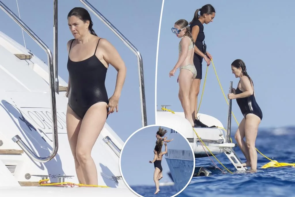 Drew Barrymore élégante en maillot noir lors d'une escapade en yacht à Saint-Tropez.